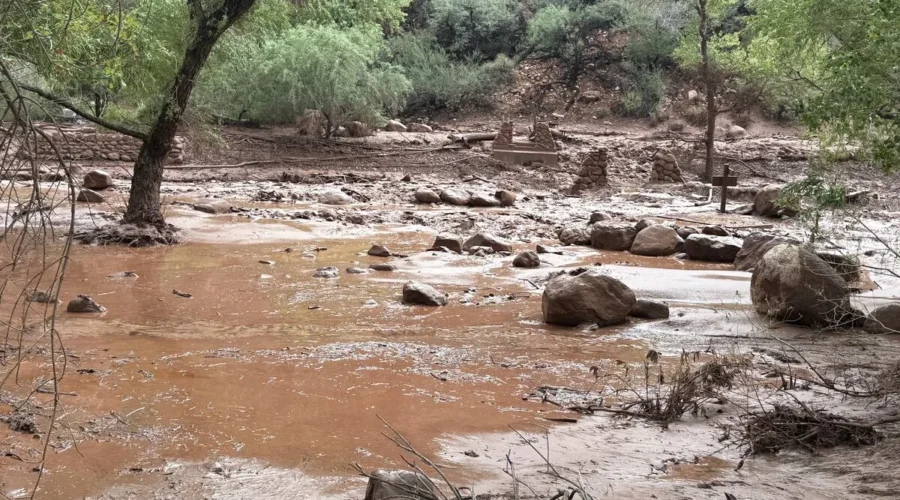 Grand Canyon National Park sign and canyon landscape during a flash flood response